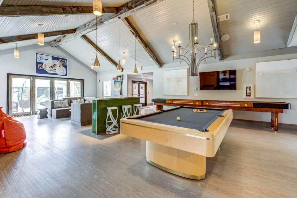 the outpost san marcos off campus apartments near texas state university resident clubhouse game room with billiard table event space